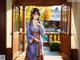 A woman in a kimono standing in front of an open door.